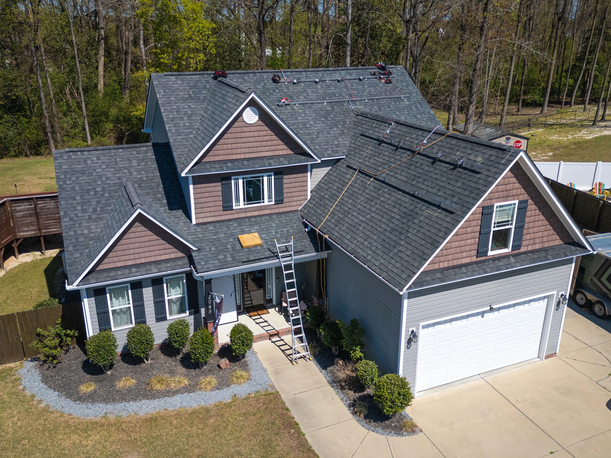 Residential roof repair work on a home exterior