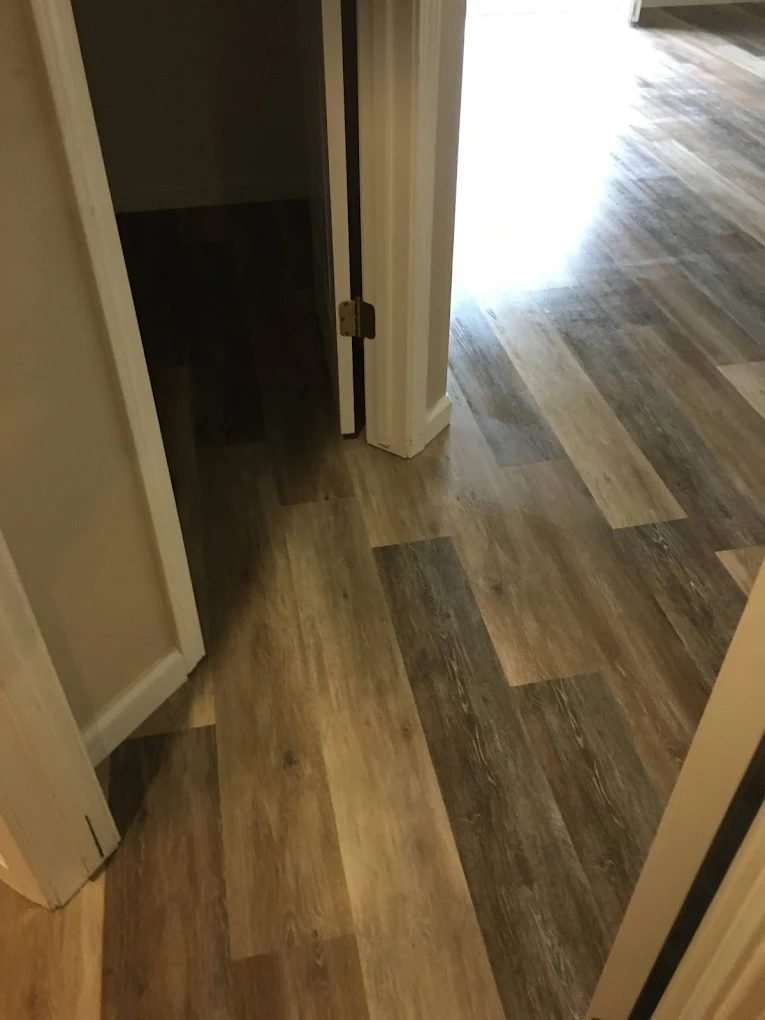 Hard flooring installation with finished trim and clean lines