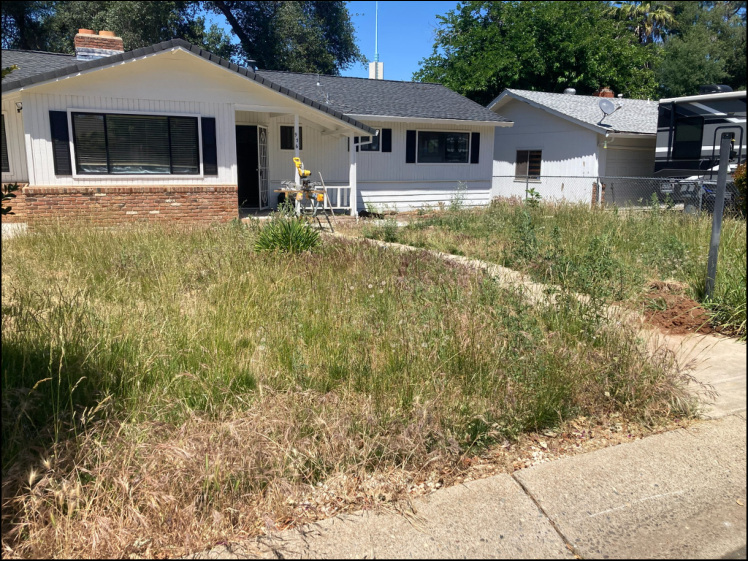 Before exterior view of a single-story home prior to remodeling