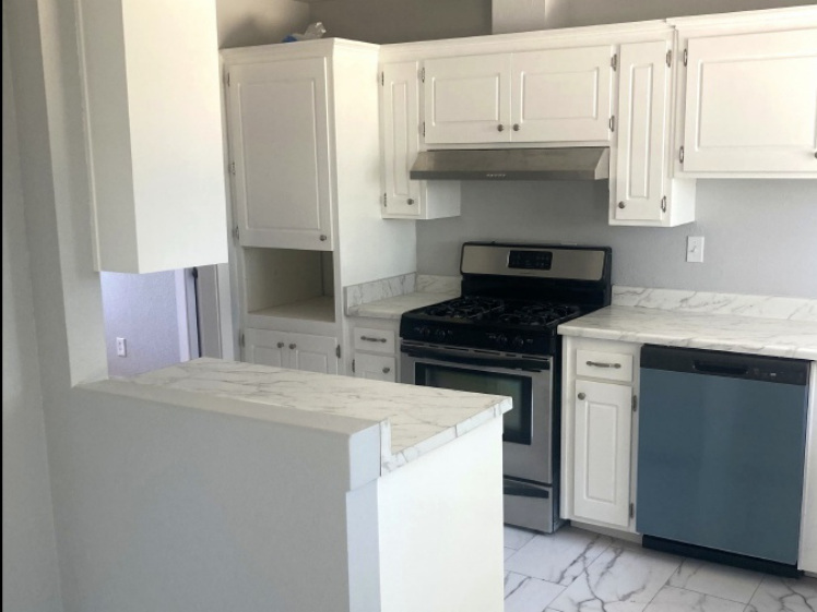 After kitchen with white cabinets and updated finishes