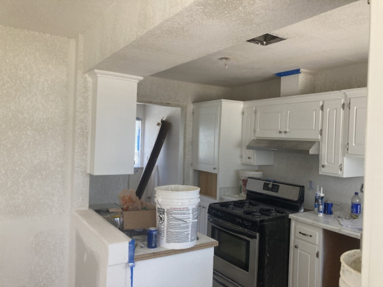 Kitchen remodel in progress with cabinetry installation underway