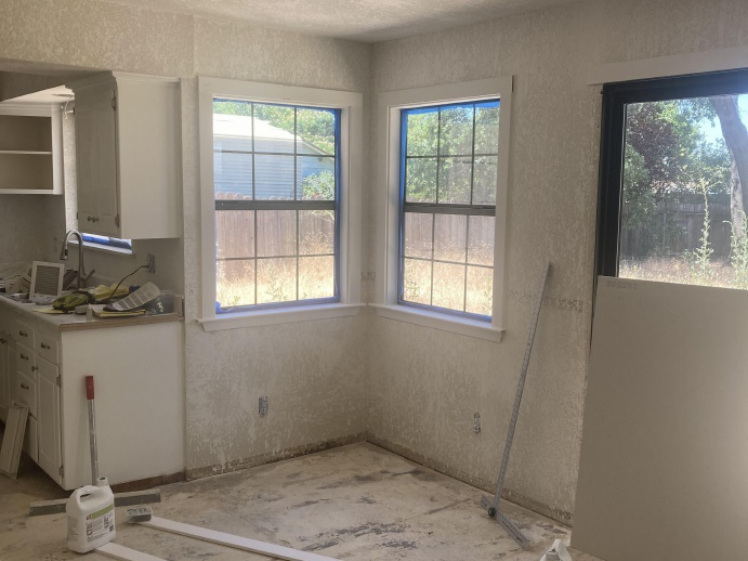 Remodeled living area during flooring and finish updates