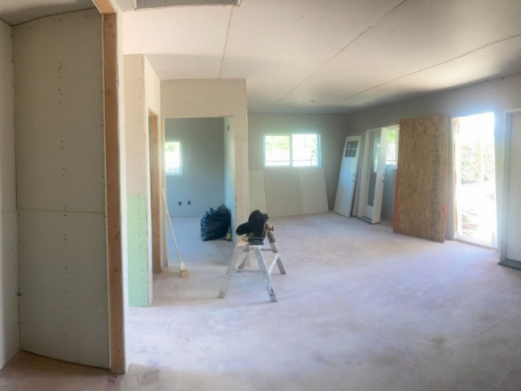 Drywall and interior build-out during garage to ADU conversion