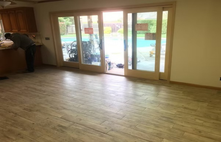 Completed multi-panel door installation opening to backyard