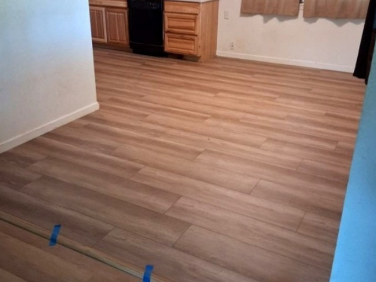 Finished wood-look flooring in an open interior space