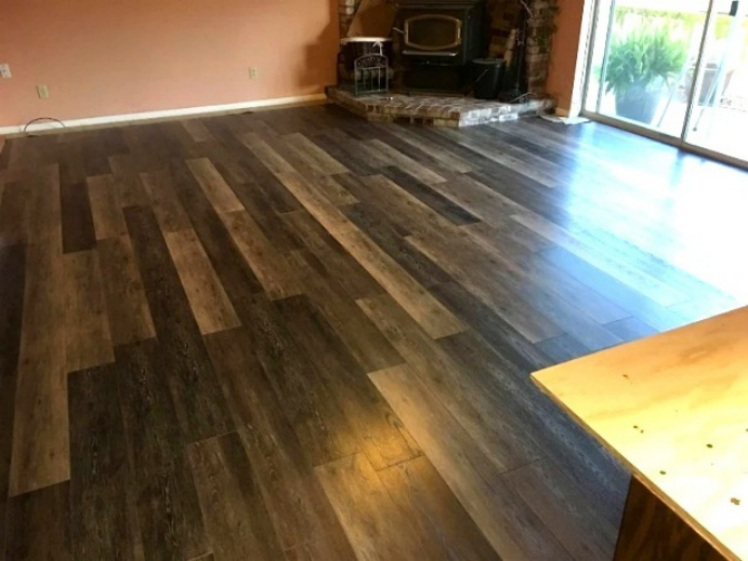 Large room with newly installed wood-look flooring
