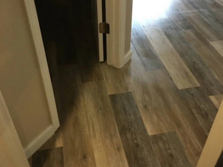 Room-to-room flooring transition with wood-look planks