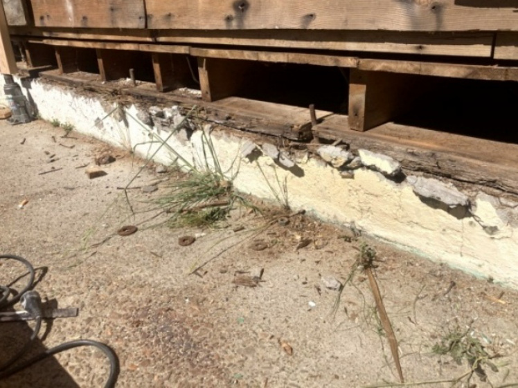 Lower wall area with visible rot and demolition during structural repair