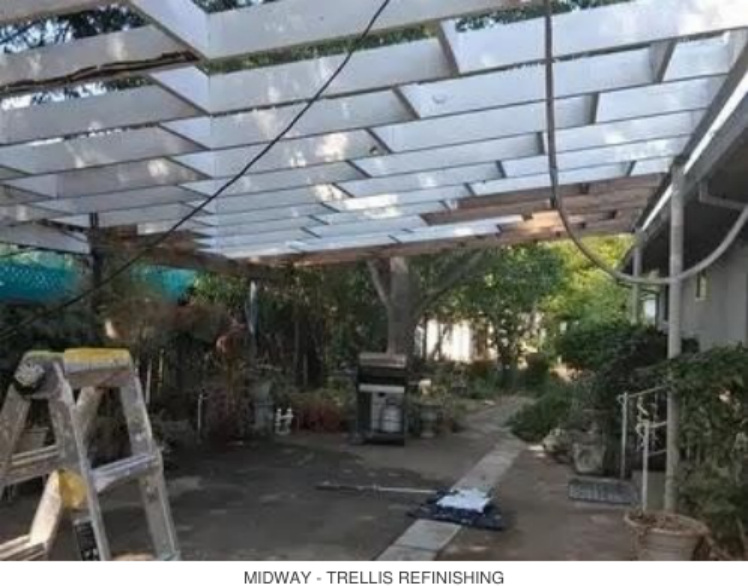 Midway view of trellis refinishing over a backyard patio walkway